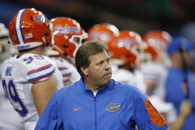 Florida head coach Jim McElwain walks before the first half of the Southeastern Conference championship NCAA college football game between Alabama and Florida, Saturday, Dec. 5, 2015, in Atlanta. (AP Photo/John Bazemore)
