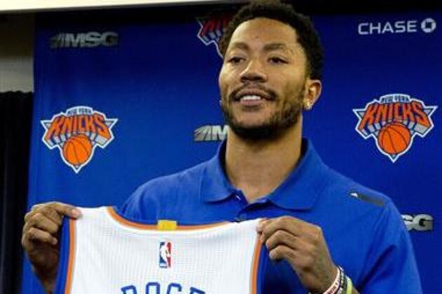Derrick Rose poses for photographers  with his New York Knicks jersey during a news conference at Madison Square Garden, Friday, June 24, 2016 in New York. The Knicks introduced Rose, the former NBA basketball MVP they acquired from the Chicago Bulls. (AP Photo/Mary Altaffer)