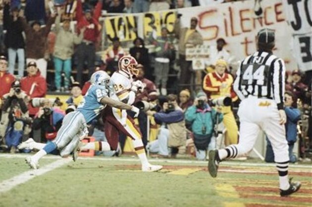 Washington Redskins wide receiver Gary Clark (84) in a 45-yard pass from Mark Rypien and scores a touchdown against Detroit Lions cornerback Sheldon White (25) during third quarter action in NFC Championship game on Sunday's Jan.13, 1992 at RFK Stadium in Washington. The Redskins defeated the Lions 41-10 and will play the Buffalo Bills in Super Bowl XXVI January 26 in Minneapolis. (AP Photo/Doug Mills)