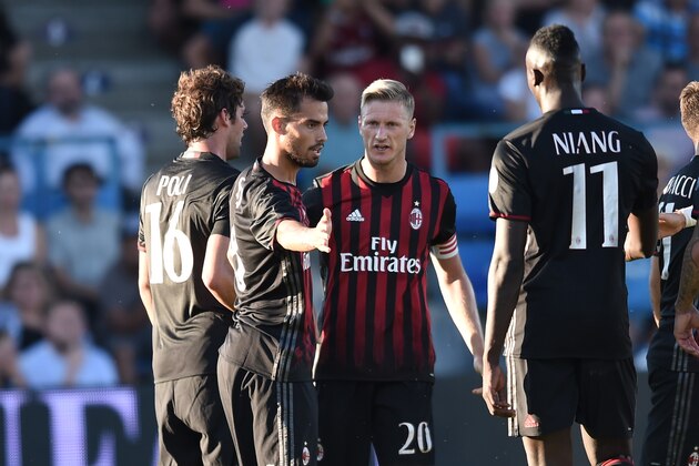 AC Milan's midfielder Suso (C) celebrates with teamamtes after scoring a goal during the friendly football between Bordeaux and AC Milan on July 16, 2016 at the Armandie stadium in Agen, southwestern France. / AFP / NICOLAS TUCAT        (Photo credit should read NICOLAS TUCAT/AFP/Getty Images)