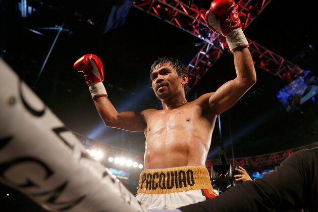LAS VEGAS, NEVADA - APRIL 09:  Manny Pacquiao celebrates after defeating Timothy Bradley Jr. by unanimous decision in their welterweight championship fight on April 9, 2016 at MGM Grand Garden Arena in Las Vegas, Nevada.  (Photo by Christian Petersen/Getty Images)