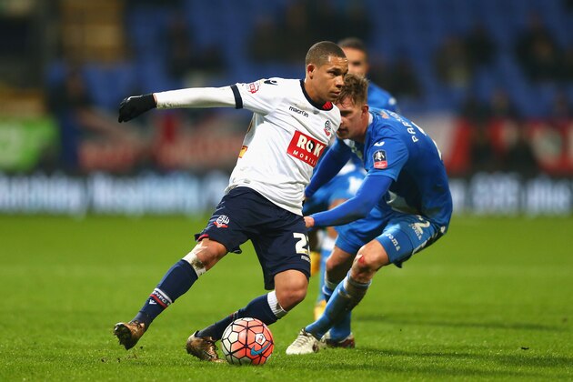 BOLTON, ENGLAND - JANUARY 19: Wellington Silva of Bolton Wanderers and Joe Partington of Eastleigh compete for the ball during the Emirates FA Cup Third Round Replay match between Bolton Wanderers and Eastleigh at Macron Stadium on January 19, 2016 in Bolton, England.  (Photo by Clive Brunskill/Getty Images)
