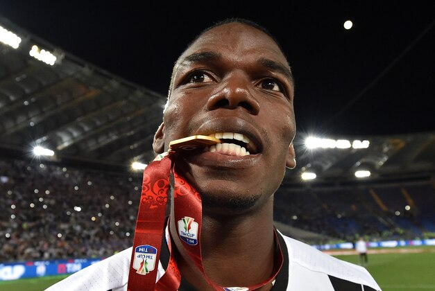 ROME, ITALY - MAY 21:  Paul Pogba of Juventus FC celebrates the victory after the TIM Cup match between AC Milan and Juventus FC at Stadio Olimpico on May 21, 2016 in Rome, Italy.  (Photo by Giuseppe Bellini/Getty Images)