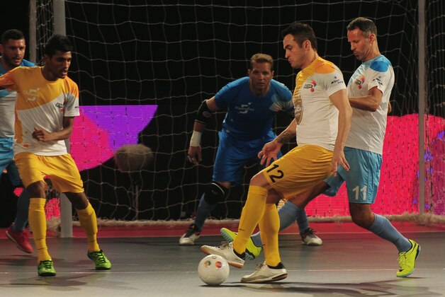 Alessandro Rosa Viera (2R), also known as Falcao, from the Chennai 5's plays against the Mumbai 5's during their Premier Futsal Football League match in Chennai on July 15, 2016. / AFP / ARUN SANKAR        (Photo credit should read ARUN SANKAR/AFP/Getty Images)
