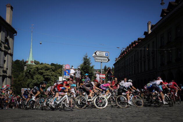 The pack rides on the cobblestones during the 209 km sixteenth stage of the 103rd edition of the Tour de France cycling race on July 18, 2016 between Moirans-en-Montagne and Berne. / AFP / KENZO TRIBOUILLARD        (Photo credit should read KENZO TRIBOUILLARD/AFP/Getty Images)