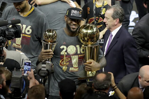OAKLAND, CA - JUNE 19: LeBron James #23 of the Cleveland Cavaliers holds the Larry O'Brien Championship Trophy and the Bill Russell NBA Finals Most Valuable Player Award after defeating the Golden State Warriors 93-89 in Game 7 of the 2016 NBA Finals at ORACLE Arena on June 19, 2016 in Oakland, California. NOTE TO USER: User expressly acknowledges and agrees that, by downloading and or using this photograph, User is consenting to the terms and conditions of the Getty Images License Agreement. (Photo by Ronald Martinez/Getty Images) OAKLAND, CA - JUNE 19: LeBron James #23 of the Cleveland Cavaliers holds the Larry O'Brien Championship Trophy and the Bill Russell NBA Finals Most Valuable Player Award after defeating the Golden State Warriors 93-89 in Game 7 of the 2016 NBA Finals at ORACLE Arena on June 19, 2016 in Oakland, California. NOTE TO USER: User expressly acknowledges and agrees that, by downloading and or using this photograph, User is consenting to the terms and conditions of the Getty Images License Agreement. (Photo by Ronald Martinez/Getty Images)