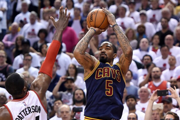 May 23, 2016; Toronto, Ontario, CAN;  Cleveland Cavaliers forward J.R. Smith (5) takes a jump shot past the arm of Toronto Raptors forward Patrick Patterson (54) in game four of the Eastern conference finals of the NBA Playoffs at Air Canada Centre. Mandatory Credit: Dan Hamilton-USA TODAY Sports