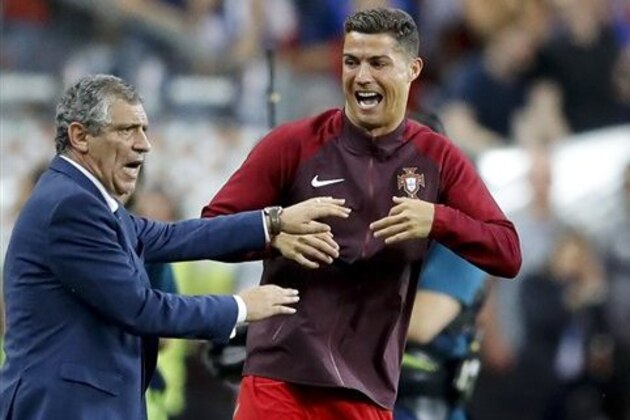 Portugal's Cristiano Ronaldo and Portugal coach Fernando Santos react moments before the end of the Euro 2016 final soccer match between Portugal and France at the Stade de France in Saint-Denis, north of Paris, Sunday, July 10, 2016. Portugal won 1-0. (AP Photo/Frank Augstein)