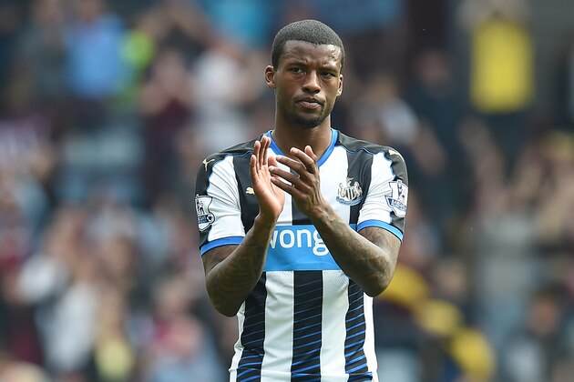 Newcastle United's Dutch midfielder Georginio Wijnaldum applauds supporters on the pitch after the English Premier League football match between Aston Villa and Newcastle United at Villa Park in Birmingham, central England on May 7, 2016.
The game ended 0-0. / AFP / Paul ELLIS / RESTRICTED TO EDITORIAL USE. No use with unauthorized audio, video, data, fixture lists, club/league logos or 'live' services. Online in-match use limited to 75 images, no video emulation. No use in betting, games or single club/league/player publications.  /         (Photo credit should read PAUL ELLIS/AFP/Getty Images)