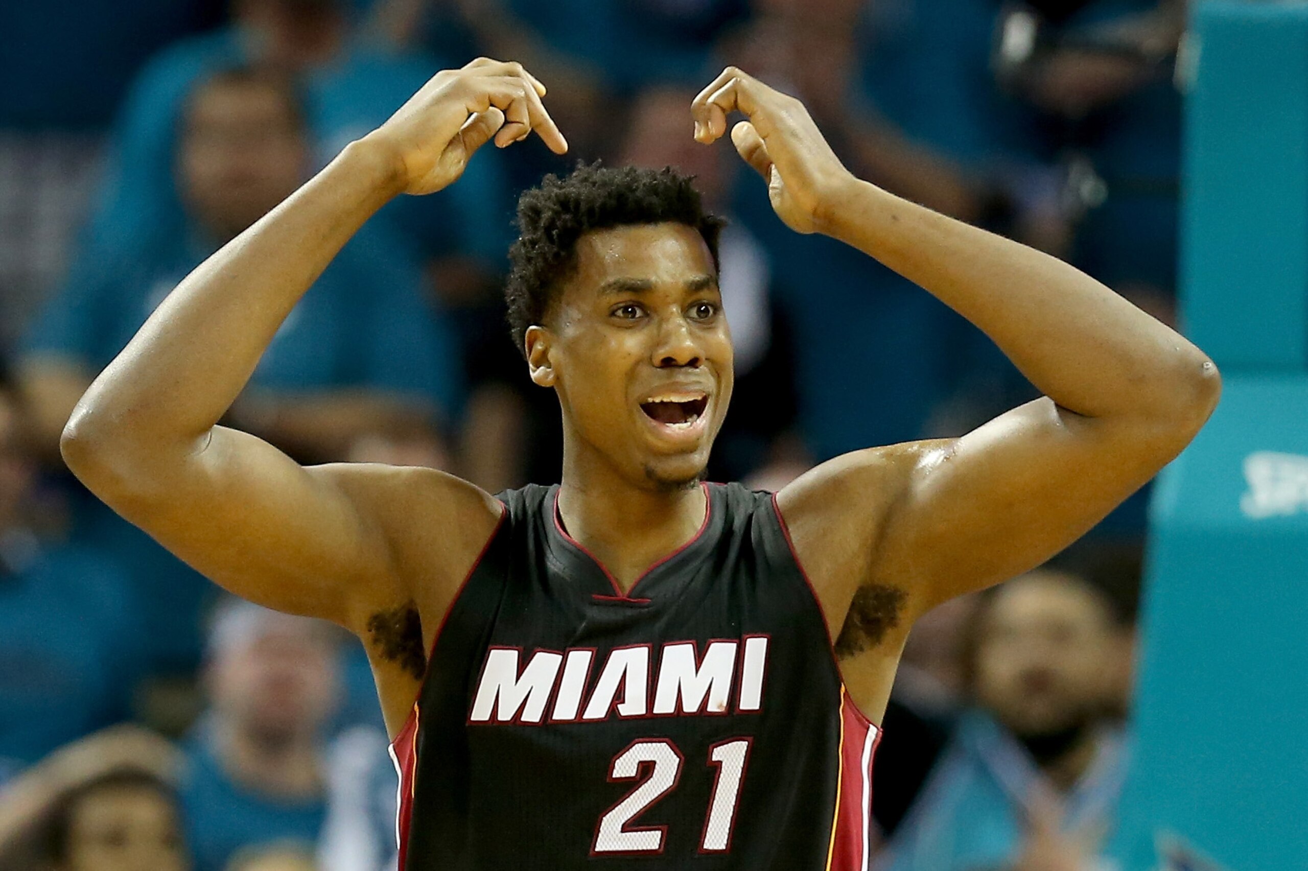 CHARLOTTE, NC - APRIL 29:  Hassan Whiteside #21 of the Miami Heat reacts after a call against the Charlotte Hornets during game six of the Eastern Conference Quarterfinals of the 2016 NBA Playoffs at Time Warner Cable Arena on April 29, 2016 in Charlotte, North Carolina.  NOTE TO USER: User expressly acknowledges and agrees that, by downloading and or using this photograph, User is consenting to the terms and conditions of the Getty Images License Agreement.  (Photo by Streeter Lecka/Getty Images)