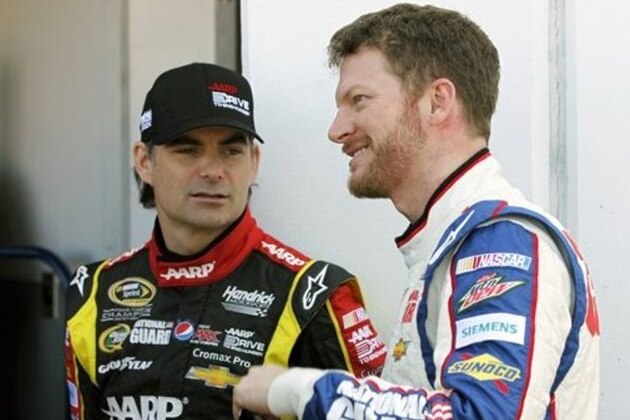 Jeff Gordon, left, and Dale Earnhardt Jr., talk outside the garage during practice for the NASCAR Daytona 500 Sprint Cup Series auto race at Daytona International Speedway, Wednesday, Feb. 20, 2013, in Daytona Beach, Fla. (AP Photo/Terry Renna)