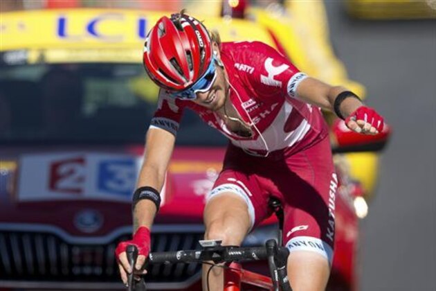 Russia's Ilnur Zakarin celebrates as he crosses the finish line to win during the seventeenth stage of the Tour de France cycling race over 184.5 kilometers (114.3 miles) with start in Bern and finish in Finhaut-Emosson, Switzerland, Wednesday, July 20, 2016. (AP Photo/Peter Dejong)