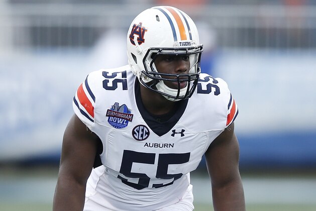BIRMINGHAM, AL - DECEMBER 30: Carl Lawson #55 of the Auburn Tigers in action against the Memphis Tigers during the Birmingham Bowl at Legion Field on December 30, 2015 in Birmingham, Alabama. Auburn defeated Memphis 31-10. (Photo by Joe Robbins/Getty Images)