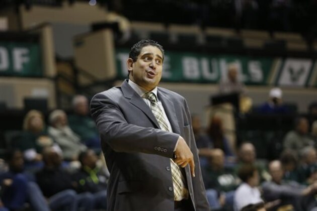 South Florida head basketball coach Orlando Antigua gestures as he speaks to a player from the bench area during the second half of an NCAA college basketball game against SMU Sunday, Feb. 7, 2016, in Tampa, Fla. (AP Photo/Brian Blanco)