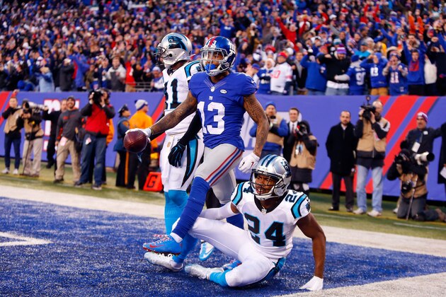 EAST RUTHERFORD, NJ - DECEMBER 20:  (NEW YORK DAILIES OUT)   Odell Beckham #13 of the New York Giants celebrates his fourth quarter touchdown against  Josh Norman #24 of the Carolina Panthers on December 20, 2015 at MetLife Stadium in East Rutherford, New Jersey. The Panthers defeated the Giants 38-35.  (Photo by Jim McIsaac/Getty Images)