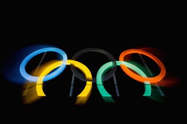 RIO DE JANEIRO, BRAZIL - JULY 19:  (EDITOR'S NOTE: Photo taken with a long exposure and zoom effect) View of the Olympic rings placed at Madureira Park, on July 19, 2016 in Rio de Janeiro, Brazil. The Rio Olympic Games run from August 5-21.  (Photo by Buda Mendes/Getty Images)