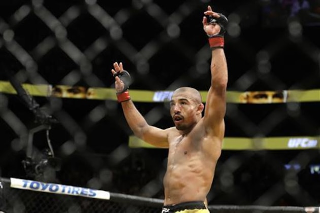 Jose Aldo celebrates after defeating Frankie Edgar during their featherweight championship mixed martial arts bout at UFC 200, Saturday, July 9, 2016, in Las Vegas. (AP Photo/John Locher)