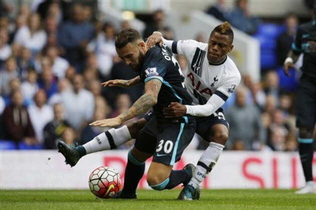 Tottenham Hotspur's Clinton N’Jie, right, competes for the ball with Manchester City's Nicolas Otamendi during the English Premier League soccer match between Tottenham Hotspur and Manchester City at White Hart Lane stadium in London, Saturday, Sept. 26, 2015.  (AP Photo/Matt Dunham)