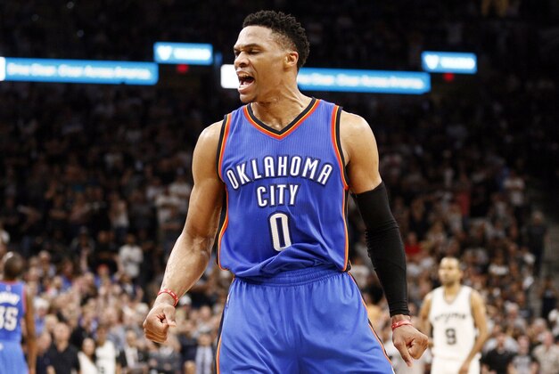 May 10, 2016; San Antonio, TX, USA; Oklahoma City Thunder point guard Russell Westbrook (0) celebrates a basket and a foul against the San Antonio Spurs after scoring in game five of the second round of the NBA Playoffs at AT&T Center. Mandatory Credit: Soobum Im-USA TODAY Sports