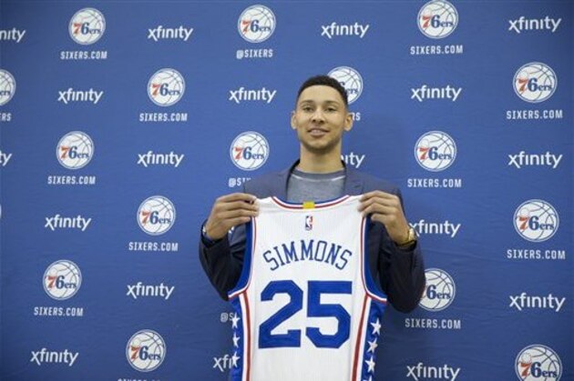 Philadelphia 76ers NBA basketball draft pick Ben Simmons poses for photographs during a news conference in Philadelphia, Friday, June 24, 2016. (AP Photo/Matt Rourke)