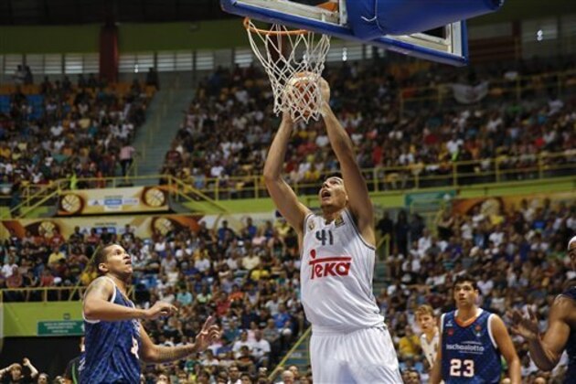 Guillermo Hernangomez of Spain's Real Madrid drives to the basket during a FIBA Intercontinental Cup against Brazil's Bauru in Sao Paulo, Brazil, Sunday, Sept. 27, 2015. (AP Photo/Andre Penner)