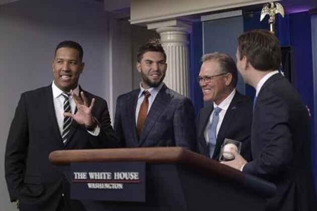 White House press secretary Josh Earnest, right, who is a big Kansas City Royals baseball team fan, holds a baseball that he was given during a surprise visit by Kansas City Royals manager Ned Yost, second from right, Salvador Perez, left, and Eric Hosmer, second from left, during the daily briefing at the White House in Washington, Thursday, July 21, 2016. (AP Photo/Susan Walsh) White House press secretary Josh Earnest, right, who is a big Kansas City Royals baseball team fan, holds a baseball that he was given during a surprise visit by Kansas City Royals manager Ned Yost, second from right, Salvador Perez, left, and Eric Hosmer, second from left, during the daily briefing at the White House in Washington, Thursday, July 21, 2016. (AP Photo/Susan Walsh)