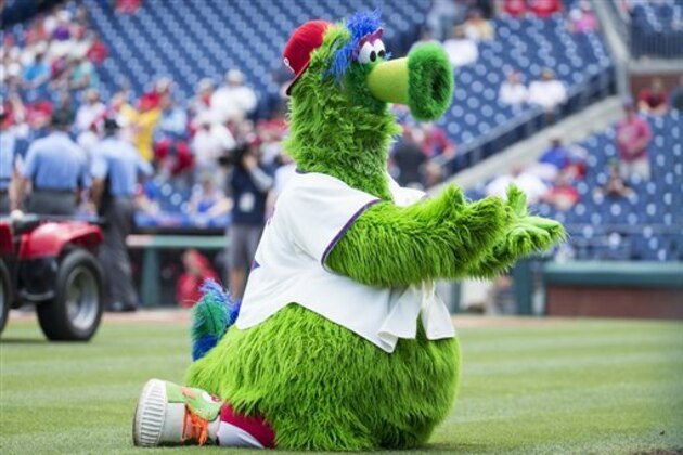 The Phillie Phanatic pleads for his All Star Jersey back prior to the first inning of a baseball game between the Atlanta Braves vs Philadelphia Phillies, Wednesday, July 6, 2016, in Philadelphia. The Phillies won 4-3. (AP Photo/Chris Szagola)