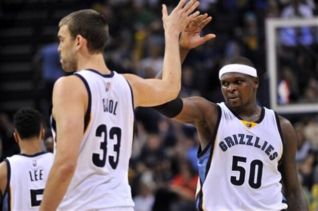 Memphis Grizzlies center Marc Gasol (33) and forward Zach Randolph (50) give each other a high-five in the first half of an NBA basketball game against the New Orleans Pelicans Wednesday, April 8, 2015, in Memphis, Tenn. (AP Photo/Brandon Dill)