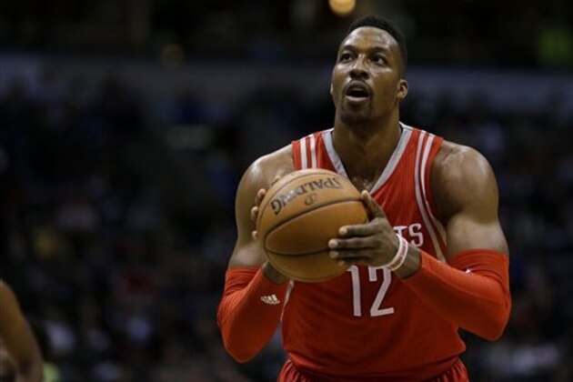 Houston Rockets' Dwight Howard shoots a free throw during the first half of an NBA basketball game against the Milwaukee Bucks Monday, Feb. 29, 2016, in Milwaukee. (AP Photo/Aaron Gash)