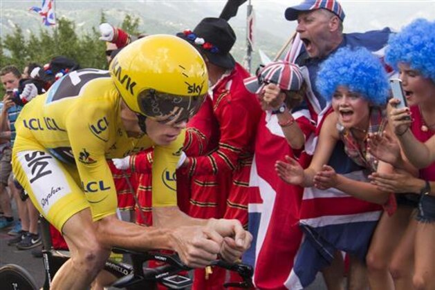 Britain's Chris Froome, wearing the overall leader's yellow jersey, climbs during the eighteenth stage of the Tour de France cycling race, an individual time trial over 17 kilometers (10.6 miles) with start in Sallanches and finish in Megeve, France, Thursday, July 21, 2016. (AP Photo/Peter Dejong)