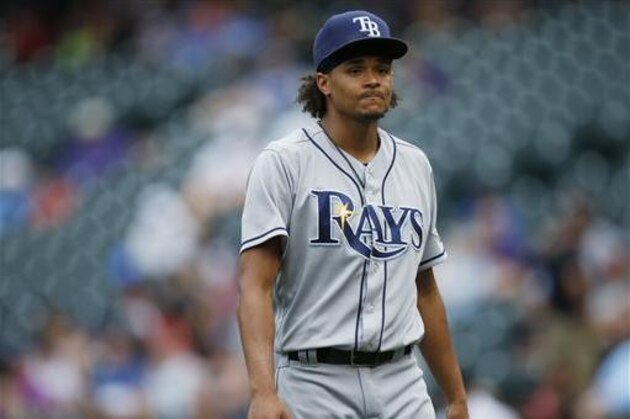 Tampa Bay Rays starting pitcher Chris Archer heads off the mound after striking out the side against the Colorado Rockies in the sixth inning of a baseball game Wednesday, July 20, 2016 in Denver. Tampa Bay won 11-3. (AP Photo/David Zalubowski)