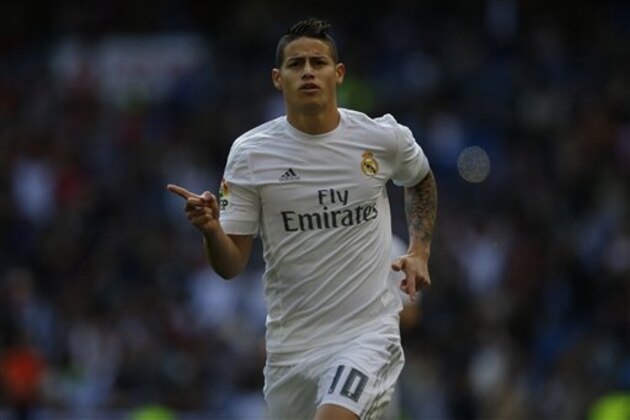 Real Madrid's James Rodriguez celebrates after scoring the opening goal against Eibar during the Spanish La Liga soccer match between Real Madrid and Eibar at the Santiago Bernabeu stadium in Madrid, Saturday, April 9, 2016. Rodriguez scored the first goal in Real Madrid's 4-0 victory. (AP Photo/Francisco Seco)