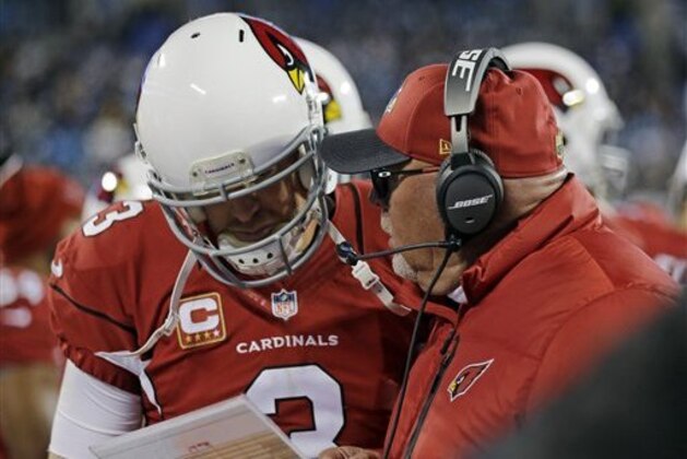 Arizona Cardinals head coach Bruce Arians talks to Carson Palmer during the second half the NFL football NFC Championship game against the Carolina Panthers, Sunday, Jan. 24, 2016, in Charlotte, N.C. (AP Photo/David J. Phillip)
