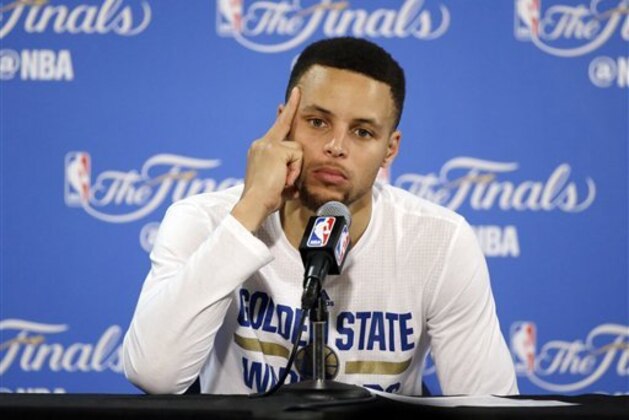 Golden State Warriors' Stephen Curry answers questions during a post-game press conference after Game 7 of basketball's NBA Finals Sunday, June 19, 2016, in Oakland, Calif. Cleveland won 93-89. (AP Photo/Eric Risberg)