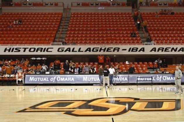 Fans begin to filter in at Gallagher-Iba Arena in Stillwater, Okla., for an NCAA college basketball game between Oklahoma State and Texas on Wednesday, Jan. 26, 2011. T-shirts with