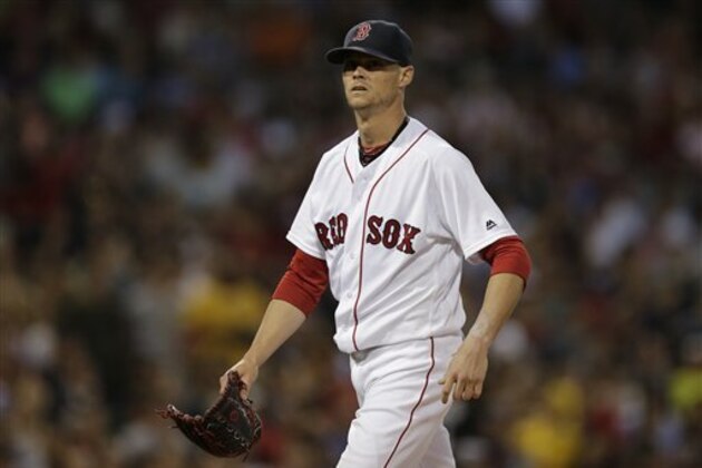 Boston Red Sox starting pitcher Clay Buchholz heads to the dugout during a baseball game at Fenway Park, Tuesday, June 21, 2016, in Boston. (AP Photo/Charles Krupa)