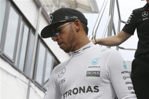 Mercedes driver Lewis Hamilton, of Britain, leaves his motorhome in the paddock, at the Hungaroring racetrack, in Budapest, Hungary, Friday, July 22, 2016. The Hungarian Formula One Grand Prix will be held on Sunday July, 24. (AP Photo/Luca Bruno)
