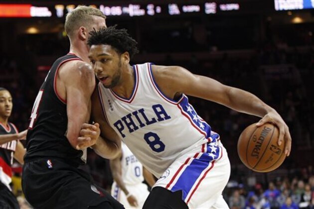 Philadelphia 76ers' Jahlil Okafor, right, drives to the basket against Portland Trail Blazers' Mason Plumlee, left, during the second half of an NBA basketball game, Saturday, Jan. 16, 2016, in Philadelphia. The 76ers won 114-89. (AP Photo/Chris Szagola)