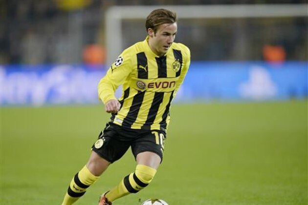 In this March 5, 2013 picture Dortmund's Mario Goetze plays during the Champions League, round of 16, second leg soccer match between Borussia Dortmund and Shakhtar Donetsk in Dortmund, Germany. Borussia Dortmund is bringing back forward Mario Goetze from Bayern Munich. Goetze left Dortmund for Bayern in 2013 but never settled down and was mostly a bench player under previous coach Pep Guardiola. Dortmund said Thursday July 21, 2016 that Goetze will sign a four-year contract once he's passed the medical examination. Details of the deal were not released.  (AP Photo/Martin Meissner)