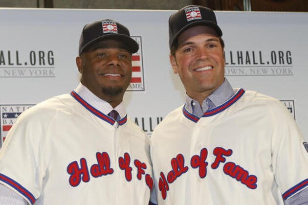 FILE - In this Jan. 7, 2016, file photo, Ken Griffey Jr., left, poses for a photograph with Mike Piazza at a press conference announcing they are both elected into the 2016 National Baseball Hall of Fame, in New York. The Seattle Mariners made Ken Griffey Jr. the first pick of the 1987 amateur draft and a year later the Dodgers selected Mike Piazza on the 62nd round with the 1,390th pick. Both left indelible imprints on the game and will be rewarded Sunday with induction into the Baseball Hall of Fame.  (AP Photo/Kathy Willens, File)