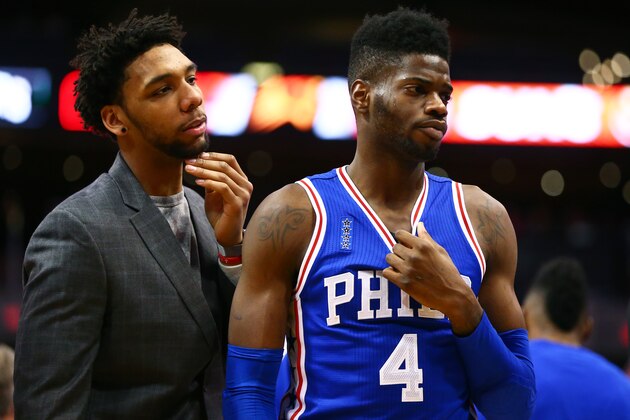 Dec 26, 2015; Phoenix, AZ, USA; Philadelphia 76ers forward Nerlens Noel (right) talks with center Jahlil Okafor against the Phoenix Suns at Talking Stick Resort Arena. Mandatory Credit: Mark J. Rebilas-USA TODAY Sports