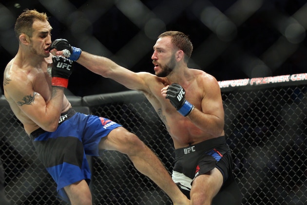 Jul 13, 2016; Sioux Falls, SD, USA; Tony Ferguson (red gloves) fights against Lando Vannata (blue gloves) during UFC Fight Night at Denny Sanford Premier Center. Mandatory Credit: Brad Rempel-USA TODAY Sports
