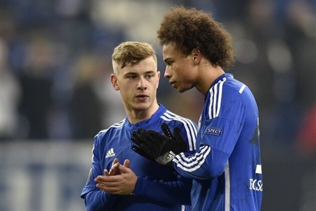 Schalke's young talents Max Meyer, left, and Leroy Sane clap hands for supporters after the Europa League group K soccer match between FC Schalke 04 and Apoel FC in Gelsenkirchen, Germany, Thursday, Nov. 26, 2015. Schalke defeated Apoel with 1-0. (AP Photo/Martin Meissner)