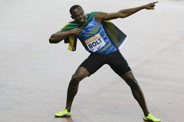 Usain Bolt of Jamaica celebrates after he wins the men's 100m final during the Diamond League athletics meeting at the Olympic Stadium in the Queen Elizabeth Olympic Park in London, Friday, July 24, 2015. (AP Photo/Kirsty Wigglesworth)