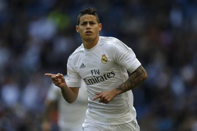 Real Madrid's James Rodriguez celebrates after scoring the opening goal against Eibar during the Spanish La Liga soccer match between Real Madrid and Eibar at the Santiago Bernabeu stadium in Madrid, Saturday, April 9, 2016. (AP Photo/Francisco Seco)