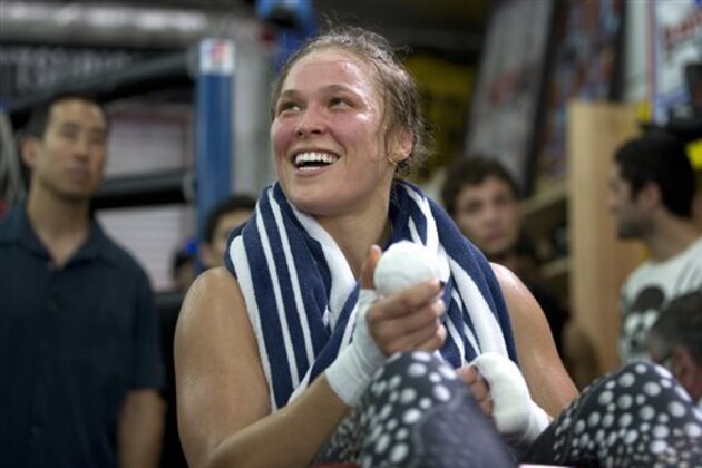 Mixed martial arts fighter Ronda Rousey smiles during her workout at Glendale Fighting Club, Wednesday, July 15, 2015, in Glendale, Calif. Rousey, the UFC bantamweight champion, will return to the octagon against Brazil’s unbeaten Bethe Correia at UFC 190 in Rio de Janeiro on Aug. 1. (AP Photo/Jae C. Hong)