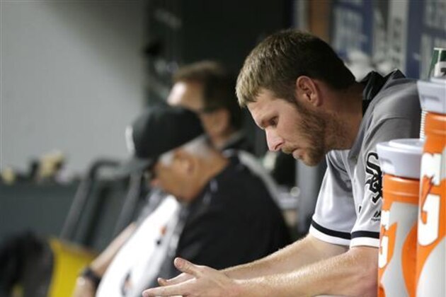 Chicago White Sox pitcher Chris Sale sits in the dugout after he threw eight shutout innings against the Seattle Mariners, giving up one hit, in a baseball game, Monday, July 18, 2016, in Seattle. White Sox' David Robertson blew the save in the ninth inning, giving up a walk-off home run to Seattle Mariners' Adam Lind, and the Mariners beat the White sox 4-3. (AP Photo/Ted S. Warren)