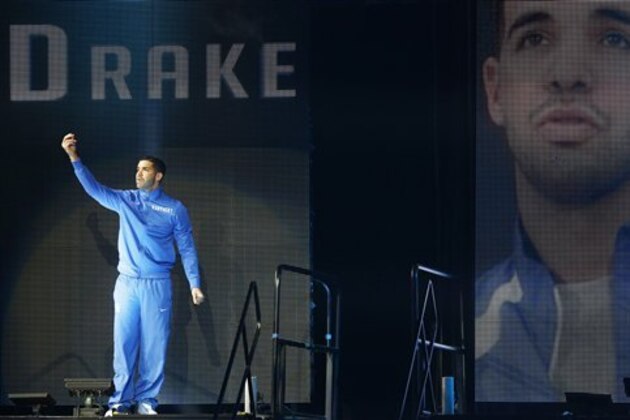 Kentucky fan and hip hop star Drake speaks to fans  during the team's NCAA college basketball Big Blue Madness, Friday, Oct. 17, 2014, in Lexington, Ky. (AP Photo/James Crisp)