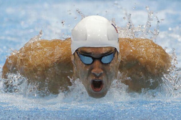 FILE - In this July 28, 2012, file photo, Michael Phelps competes in a heat of the men's 400-meter individual medley at the 2012 Summer Olympics in London. After retiring and then un-retiring, Phelps will be in Rio as the first U.S. male swimmer to compete in five Olympics. (AP Photo/Michael Sohn, File)