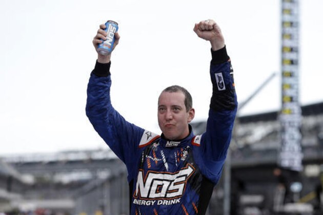 Kyle Busch celebrates after winning the NASCAR Xfinity Series auto race at Indianapolis Motor Speedway in Indianapolis, Saturday, July 23, 2016. (AP Photo/Michael Conroy)